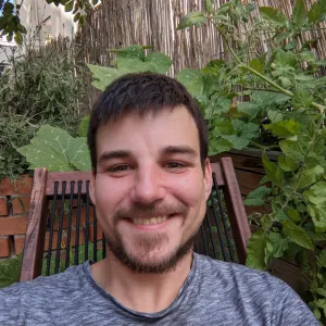 portrait of the author, smiling into the camera